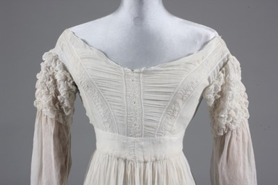 Lot 86 - A whitework embroidered gown, 1830s, with...