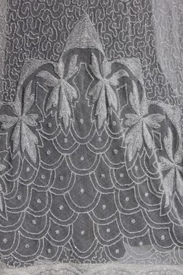 Lot 92 - A fine beaded evening coat, early 1920s, of...