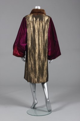 Lot 95 - A magenta velvet and gold lamé evening coat,...