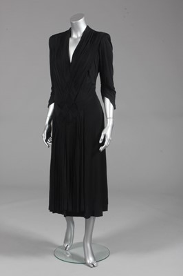 Lot 138 - A black jersey cocktail dress, attributed to...