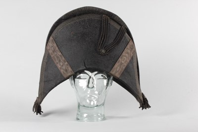 Lot 71 - A bicorne hat, circa 1790, of black beaver...