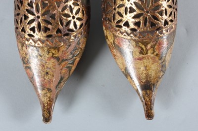 Lot 64 - A fine and rare pair of gilded and painted...