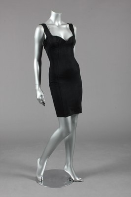 Lot 100 - An Azzedine Alaia black knitted silk dress,...