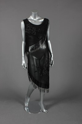 Lot 123 - A beaded black chiffon tunic, circa 1925, the...