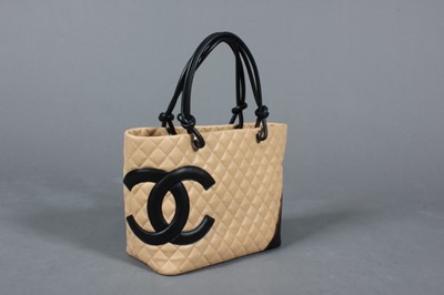 Lot 137 - A Chanel quilted beige leather shopper, 1990s,...