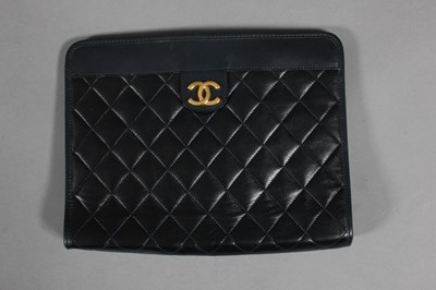 Lot 138 - A Chanel navy quilted leather clutch bag,...