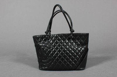 Lot 139 - A Chanel black quilted leather shopper, 1990s,...