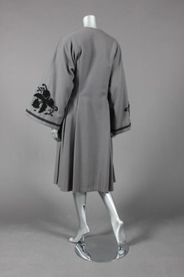 Lot 143 - An Edwardian-style grey wool coat, with black...