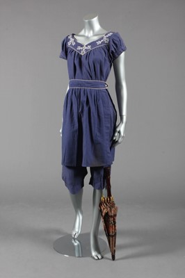 Lot 160 - A blue cotton bathing suit, circa 1910-20,...