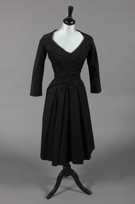 Lot 177 - A black cotton Dior-style cocktail dress,...