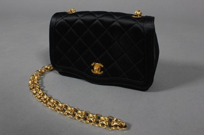 Lot 179 - A Chanel black quilted satin bag, 1990s,...