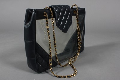 Lot 181 - A Chanel navy leather shopper, 1990s, with...