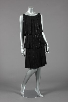 Lot 237 - A Norman Hartnell couture beaded black wool...