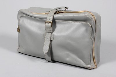 Lot 26 - A suite of powder blue leather luggage,...