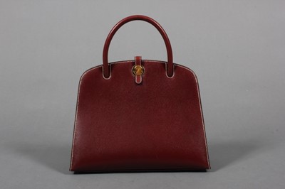 Lot 294 - An Hermès Paris ox-blood leather 'Dalvy' bag,...