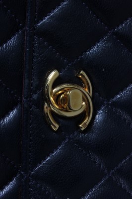 Lot 322 - A Chanel navy quilted leather miniature...