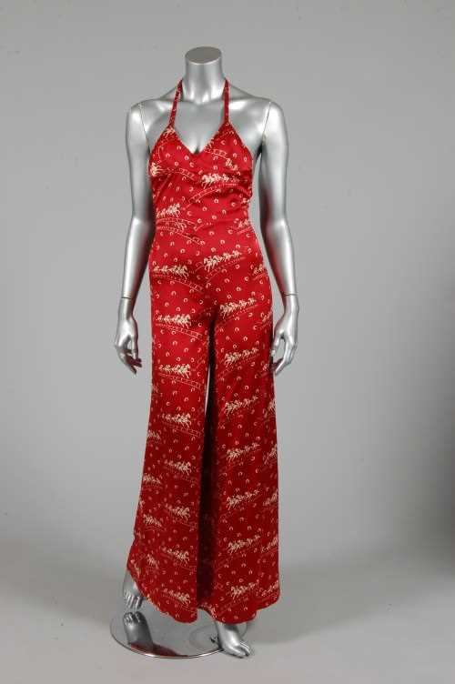 Lot 330 - A Biba printed satin halter-neck jump-suit,...