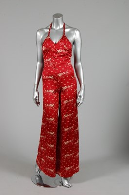 Lot 330 - A Biba printed satin halter-neck jump-suit,...