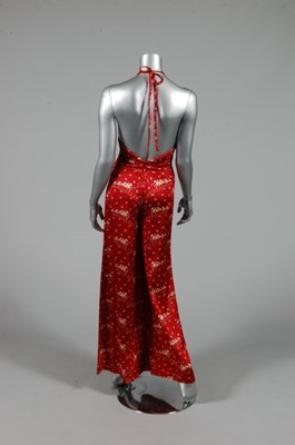 Lot 330 - A Biba printed satin halter-neck jump-suit,...