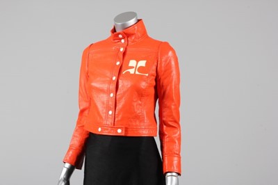 Lot 34 - A Courrèges orange vinyl jacket, late...