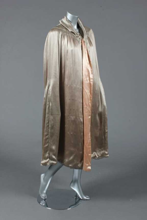 Lot 381 - A silver-grey satin cape with early Chanel