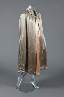 Lot 381 - A silver-grey satin cape with early Chanel...