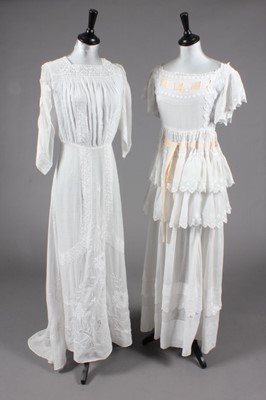 Lot 383 - A whiteworked muslin summer gown circa 1910-14,...