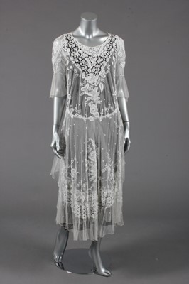 Lot 384 - A lace bridal/summer gown, early 1920s, the...