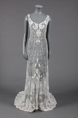 Lot 388 - An embroidered tulle bridal gown, circa 1900,...