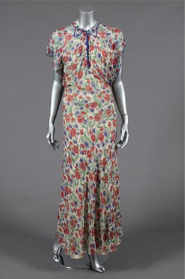 Lot 395 - A printed chiffon garden party gown, mid 1930s,...