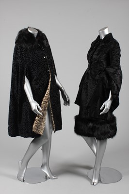 Lot 39 - A leopard lined black velvet cape, 1950s, but...