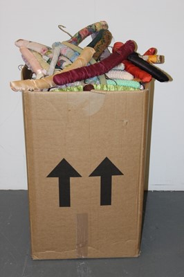 Lot 404 - A large box of assorted padded hangers,...