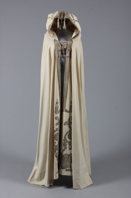 Lot 40 - An embroidered felted wool cape, Middle...