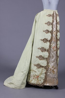 Lot 379 - A fine embroidered pale green silk skirt,...