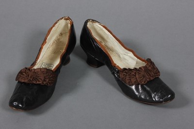 Lot 380 - A pair of Daniel Neal black leather shoes,...