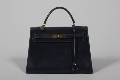 Lot 41 - An Hermès navy leather Kelly bag, 1960s, with...