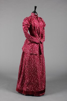 Lot 62 - A printed silk dress, circa 1888-90, the wine...