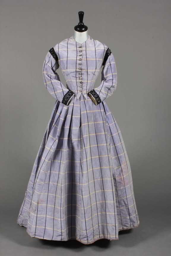 Lot 63 - A lilac tartan moire taffeta gown with day and...