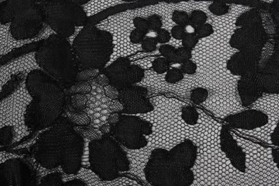 Lot 7 - A fine black Chantilly bobbin lace shawl,...