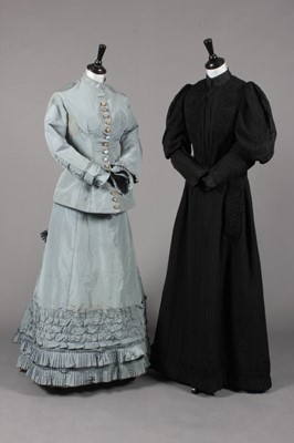 Lot 75 - A pale grey-blue faille gown, late 1870s,...