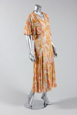 Lot 121 - A printed chiffon garden party gown, mid 1930s,...