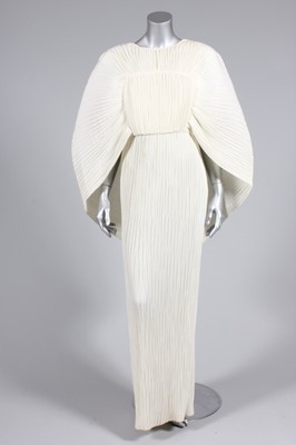 Lot 17 - A Yuki ivory pleated evening gown,...
