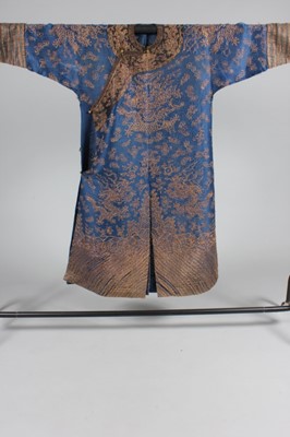 Lot 181 - An embroidered blue silk gauze dragon robe,...