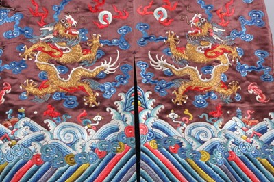 Lot 182 - A boy's chestnut satin embroidered dragon robe,...