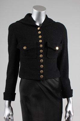 Lot 204 - A Chanel black wool jacket, early 1990s,...