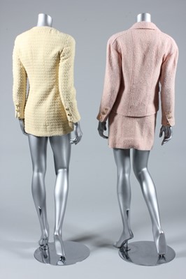 Lot 207 - A Chanel pink tweed suit, 1980s, boutique...