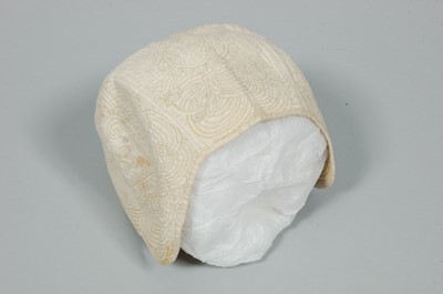 Lot 6 - An infant's false quilted linen cap, circa...
