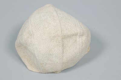 Lot 6 - An infant's false quilted linen cap, circa...