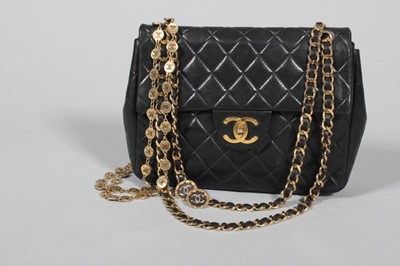 Lot 327 - A Chanel black quilted leather bag, 1980s,...