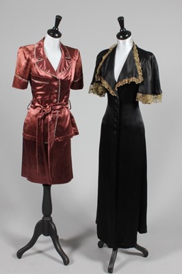 Lot 377 - A Biba black satin negligee-dress, mid 1970s,...